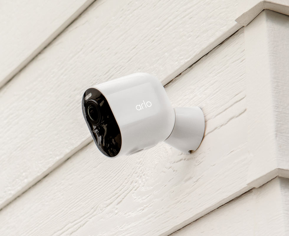 Arlo Ultra 2 Wireless wide angle camera attached to a house