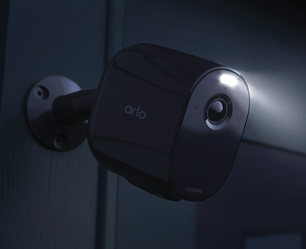 Arlo Essential Spotlight security camera light turned on at night