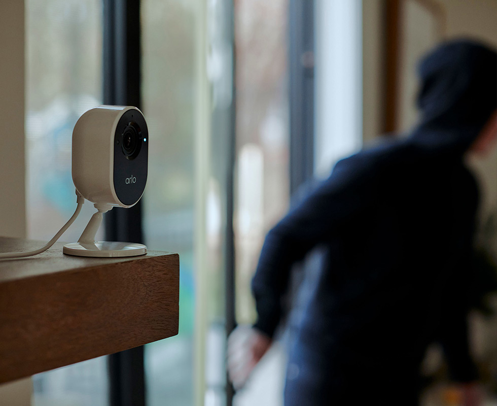 An Arlo Indoor Wireless Security camera catches a home intruder.