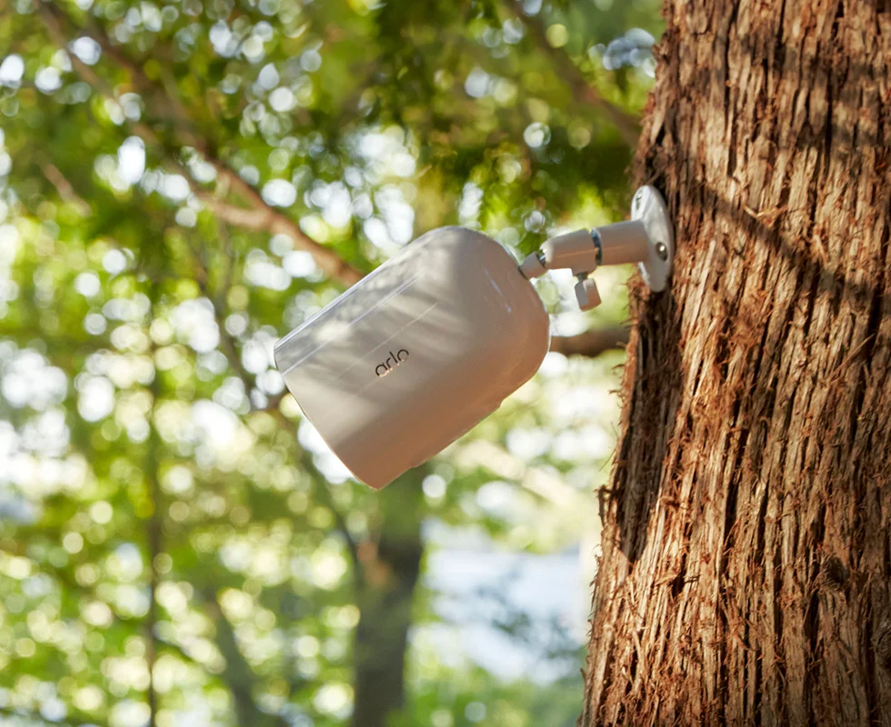 Arlo Go 2 LTE Enabled Security Camera mounted on a tree.