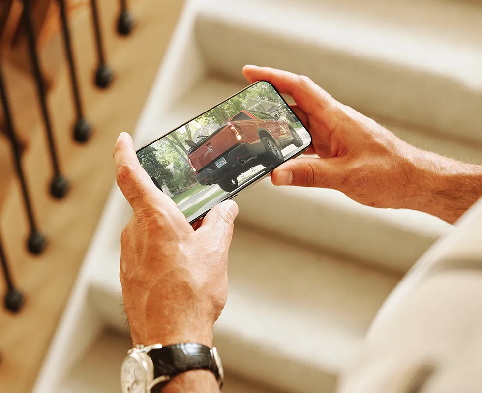 Man monitoring his security camera with a smartphone